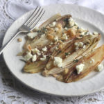 Pan-fried chicory (endive) with feta and hazelnuts